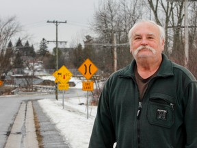 Kingston Mills resident Dale Duetta has submitted a petition, signed by all of his neighbours, to Countryside District councillor Richard Allen asking for three street lights be installed along their rural road leading to the locks. (ulia McKay/The Whig-Standard)