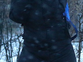 A woman deals with high winds and blowing snow in Toronto on Sunday.
(CRAIG ROBERTSON, Toronto Sun)