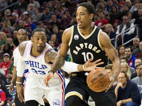 Toronto Raptors guard DeMar DeRozan (10) dribbles past Philadelphia 76ers forward Robert Covington (33) during the first quarter at Wells Fargo Center.  Bill Streicher-USA TODAY Sports