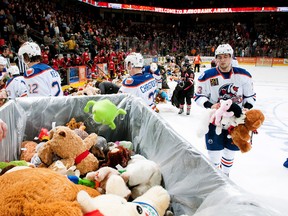 American Hockey League (AHL) Bakersfield Condors #33 helps collect donations during the Teddy Bear toss game on Nov. 28, 2015 against the Stockton Heat. The Condors are owned by  Oilers Entertainment Group (OEG). Photo Mark Nessia/Mark Nessia Photography