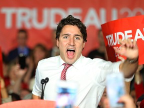 Justin Trudeau greets supporters upon arriving at the podium during a rally in Winnipeg on Oct. 17, 2015. (Kevin King/Winnipeg Sun/Postmedia Network Files)