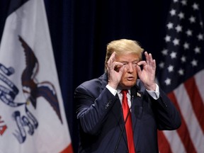 U.S. Republican presidential candidate Donald Trump gestures during his speech at the Bridge View Center in Ottumwa, Iowa, January 9, 2016. REUTERS/Mark Kauzlarich