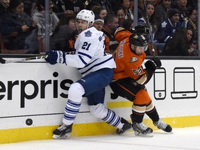 Toronto Maple Leafs left wing James van Riemsdyk and Anaheim Ducks defenceman Shea Theodore battle for the puck on Jan. 6, 2015 in Anaheim. (Kirby Lee-USA TODAY Sports)