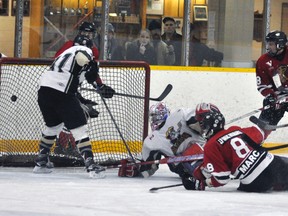 Wil Marcy (8) of the Mitchell Hawks scores this third period into essentially an open net during a skirmish against the visiting Mount Forest Patriots last Sunday, Jan. 10 in Western Jr. C hockey action. Mount Forest scored four power play goals, and another shorthanded, in a 6-4 win. ANDY BADER/MITCHELL ADVOCATE