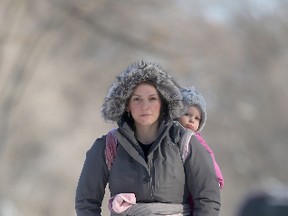 Kathryn Labulk and others opposed a proposed subdivision of a lot on Somerset Street. She is seen here walking down her street with her baby, Addison. (FILE PHOTO)