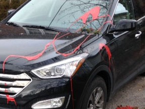 Vehicles belonging to MP Mark Gerretsen and Art Milnes, an organizer for the Sir John A. Macdonald birthday celebration, were hit by red paint sometime early Monday morning. Michael Lea/The Whig-Standard