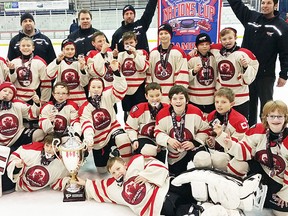 QRD minor atoms celebrate their Nations Cup title in Rochester.