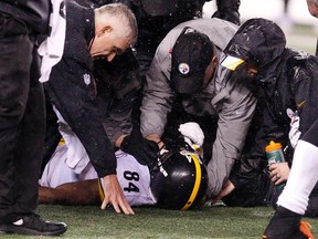 Steelers wide receiver Antonio Brown (84) is looked at by medical staff on the field during fourth quarter action against the Bengals in the AFC Wild Card playoff game at Paul Brown Stadium in Cincinnati on Saturday, Jan. 9, 2016. (David Kohl/USA TODAY Sports)