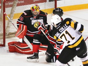 Kingston Frontenacs forward Michael Dal Colle fires a shot at Owen Sound Attack goalie Michael McNiven during Ontario Hockey League action in Owen Sound on Saturday. Dal Colle was acquired from the Oshawa Generals on Jan. 1 (James Masters/Postmedia Network)