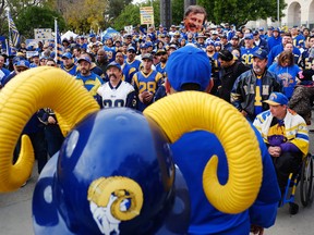 Rams fans gather for a rally at the Los Angeles Memorial Coliseum on Saturday, Jan. 9, 2016. The NFL's owners are expected to decide this week whether any combination of the Rams, Chargers and Raiders will be allowed to move to Los Angeles. (Richard Vogel/AP Photo)