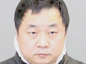 Biao Zhou, 47, is accused of forcibly confining and sexually assaulting a 22-year-old woman in downtown Toronto on Jan. 10, 2016. (Supplied photo/Toronto Police)