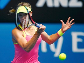 Eugenie Bouchard of Canada hits a return to Irina-Camelia Begu of Romania during their women's singles fourth round match at the Australian Open 2015 tennis tournament in Melbourne January 25, 2015.  REUTERS/Issei Kato