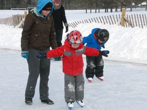The city's outdoor community skating rink adjacent to Msgr. Morrison school proved a popular destination last winter. Four-year-old Virgil Pettigrew, red coat, tries a solo skate, closely watched by mom, Danielle. Behind, four-year-old Lucas Crabe maintains his balance with mom, Danielle, close by.