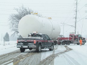A large industrial vessel makes its way down Confederation Line on Tuesday January 12, 2016 in Sarnia, Ont. The vessel was made by Alliance Fabricating in Sarnia and was being delivered to a customer in Chemical Valley. Another large unit built by the company was set to leave for shipping to Alberta but the company has had to find a new route through the U.S. because of the failure of a bridge on the Trans-Canada Highway in northwestern Ontario. (Paul Morden, The Observer)