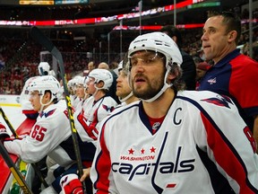 Washington Capitals forward Alex Ovechkin (8) watches from the bench during the first period against the Carolina Hurricanes at PNC Arena. The Capitals won 2-1. James Guillory-USA TODAY Sports