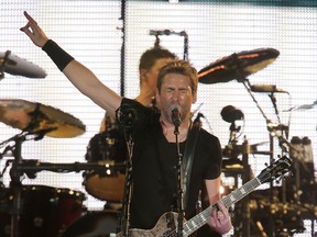 Chad Kroeger, lead singer for Nickelback, performs at the Scotiabank Saddledome in Calgary March 12, 2015. (Stuart Dryden/Postmedia Network)