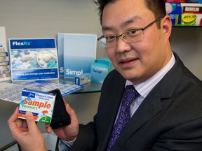 James Lee, the Director of Technology and Innovation for Jones Packaging of London demonstrates a new prescription drug packaging that includes near-field communication (NFC) that will allow the user with a cell phone to read information about the drug on an cell phone app. (MIKE HENSEN, The London Free Press)