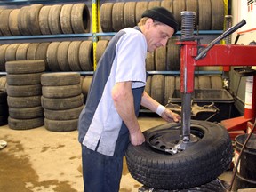 Maurice Thibeault is seen in this January 2016 Postmedia file photo working as a tire technician at Brooks Tire in Chatham. A former colleague there described him as "laid back" as a war over a $6-million winning Lotto 6/49 ticket brews.