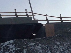 Damage to the newly built Nipigon River Bridge in Nipigon, Ont., cut traffic on the Trans-Canada Highway in both directions Sunday, Jan. 10, 2016. (THE CANADIAN PRESS/Marc Paquette)