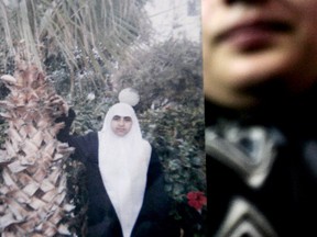 FILE - In this Monday Nov. 6, 2006 file photo, an unidentified relative holds a photo of Palestinian female suicide bomber Merfat Masoud at the family house in the northern Gaza Strip town of Beit Lahiya. While most suicide bombers are men, Islamic militant groups have occasionally deployed women to carry out such attacks. Long before the rise of Islamic radicalism, women suicide bombers were used by leftist and separatist groups in the Arab and beyond. (AP Photo/Khalil Hamra, File)