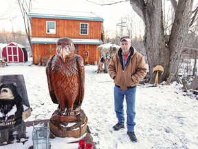 Newburgh resident Greg Morris had four of his original carvings stolen from his yard on New Year’s Day. He’s offering a reward to anyone who has information about what may have happened. (Meghan Balogh/Postmedia Network)