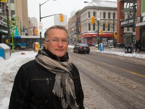 Jim Yanchula, the manager of Urban Regeneration poses on a section of Dundas Street which may be transformed into a Flex-Street, in the future. (MIKE HENSEN, The London Free Press)