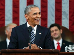 U.S. President Barack Obama (C) smiles while delivering his final State of the Union address to a joint session of Congress in Washington January 12, 2016. REUTERS/Evan Vucci/Pool