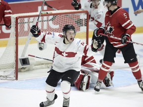 Dario Meyer scored for Switzerland against Canada at the world junior championship (heikki Saukkomaaa/REUTERS).
