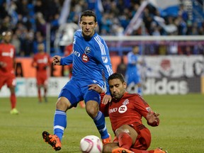 Toronto FC defender Ahmed Kantari (41) tackles the ball away from Montreal Impact midfielder Dilly Duka (5) during the second half at Stade Saputo. Eric Bolte-USA TODAY Sports