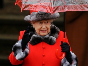 Britain's Queen Elizabeth II waves at the crowd of well-wishers as she leaves after attending the British royal family's traditional Christmas Day church service at St. Mary Magdalene Church in Sandringham, England, Friday, Dec. 25, 2015.  (AP Photo/Matt Dunham)