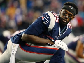 New England Patriots defensive end Chandler Jones (95) stretches before their game against the Buffalo Bills at Gillette Stadium. Winslow Townson-USA TODAY Sports