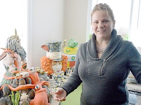 Linda Gebara stands beside a few of her award-winning cakes, in the back of her Chatham residence. She runs a successful independent cake-making business -- Linda's Creations -- where she makes custom cakes -- and like those behind her, they are all edible.