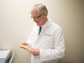 Dr. Steven McCabe is pictured in a consulting room, following a news conference held to discuss Canada's first hand transplant at Toronto's Western General Hospital, on Tuesday, January 12, 2016. Dr. McCabe led a team of surgeons at UHN to complete Canada's first upper limb transplant when they attached the forearm and hand matched from a donor to a patient who had been evaluated as a suitable candidate. McCabe was raised in Dresden where he attended elementary school and high school. (THE CANADIAN PRESS/Chris Young)