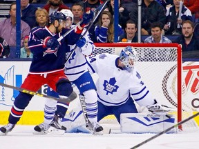 James Reimer stops a shot as Nick Foligno of the Columbus Blue Jackets attempts to screen him during a game on Oct. 16, 2015 at Nationwide Arena in Columbus, Ohio. Toronto defeated Columbus 6-3. (Kirk Irwin/Getty Images/AFP)