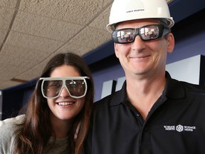 Marketing specialist Justine Martin and Vince Murphy, project manager of the IMAX Theatre renovation, wear the old and new (right) 3D glasses outside the theatre at Science North in Sudbury, Ont. on Tuesday January 12, 2016. The theatre is undergoing a major transformation with the installation of new laser projection and sound systems, and a new screen. The old projection system used film. The theatre will reopen to the public on Feb. 6. John Lappa/Sudbury Star/Postmedia Network