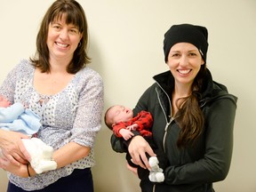 Kristen Stensrud, left, and her New Year’s Baby, Scarlett Anne met Sariah Brasnett’s Christmas baby, Lux Henderson, right, for the first time when they accepted their quilts from the Quilters Guild of Pincher Creek. Caitlin Clow photo/Pincher Creek Echo