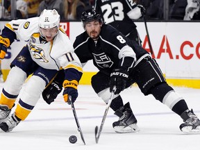 Nashville Predators centre Cody Hodgson (11) battles Los Angeles Kings defenceman Drew Doughty for the puck in Los Angeles Saturday, Oct. 31, 2015. (AP Photo/Alex Gallardo)