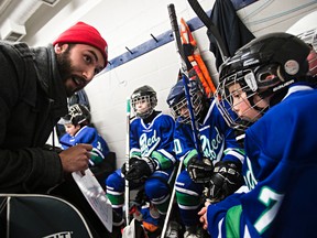 Coach Keon Collett gives his players a pep talk during the 2016 Quikcard Edmonton Minor Hockey Week at Kenilworth Arena.