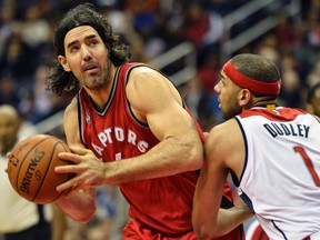 Toronto Raptors forward Luis Scola (4) looks to shoot as Washington Wizards forward Jared Dudley (1) defends during the second quarter at Verizon Center. (Tommy Gilligan/USA TODAY Sports)