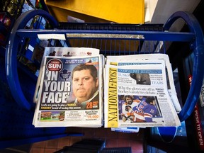 Toronto Sun and National Post newspapers are seen on a newsstand in Toronto, October 6, 2014. REUTERS/Mark Blinch