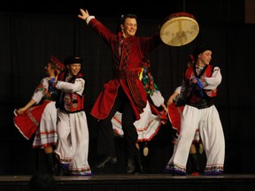 FILE- From left, Joe Hoffman, a Ukrainian dancer from Shumka of Edmonton, jumps in the air while performing a Transcarpathian dance, during the Malanka Ukrainian New Year celebration at the Bowes Family Gardens on 99 Avenue in Grande Prairie, Alta. on Saturday, Jan. 31, 2015. Malanka was rung in on Saturday night with various performances by the Troyanda Ukrainian Dancers and the Ukrainian dancers with Shumka of Edmonton. In addition to the new year, the Troyanda Society of Ukrainian Culture and Heritage was also celebrating its 40th anniversary. (ALEXA HUFFMAN/DAILY HERALD TRIBUNE/QMI AGENCY)