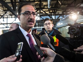 Federal Minister of Infrastructure Amerjeet Sohi speaks to the media following a tour of the construction site of the future Tremblay LRT Station.  Wednesday January 13, 2016. Errol McGihon/Ottawa Sun/Postmedia Network