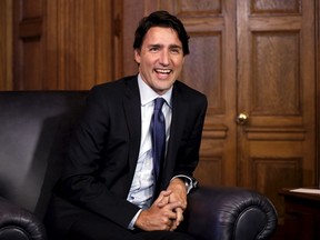 Canada's Prime Minister Justin Trudeau laughs during a meeting with Nova Scotia Premier Stephen McNeil (not pictured) in Trudeau's office on Parliament Hill in Ottawa, Canada, January 13, 2016. REUTERS/Chris Wattie