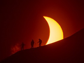 Reuben Krabbe's epic photo of total eclipse from Svalbard, Norway. The image was captured on a Nikon D4 camera with a 500mm lens with a 1.7 teleconverter with a special neutral density filter used to hold back some of the incredible brightness of the sun and get the exposure down to a shutter speed 1/1000 second at 400 ISO with an aperture of f8. Reuben Krabbe Photo