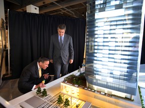 JW Marriott President and CEO Arne Sorenson (l) and Don Cleary Marriott Hotel Canada President checks out the ICE District display. JW Marriott was announced as the ICE District hotel partner during a news conference at ICE headquarters in Edmonton, Alberta on January 12. 2016. Perry Mah/Edmonton Sun/Postmedia Network