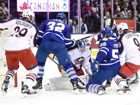 Columbus Blue Jackets goalie Joonas Korpisalo makes a save during a goalmouth scramble against Toronto Maple Leafs in the first period at Air Canada Centre in Toronto on Jan. 13, 2016. (Dan Hamilton/USA TODAY Sports)