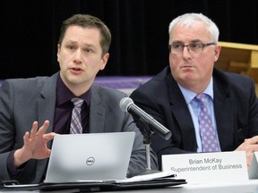 Lambton Kent District School Board superintendent of business Brian McKay, while sitting beside director of education Jim Costello, answers a question from an Accommodation Review Committee member during a meeting Wednesday at St. Clair Secondary School . The ARC committee discussed the recommendation to consolidate St. Clair and Sarnia Collegiate Institute and Technical School. (Terry Bridge/Sarnia Observer/Postmedia Network)