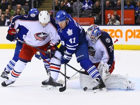 Maple Leafs forward Leo Komarov looks for a rebound in front of Columbus Blue Jackets goalie Joonas Korpisalo on Wednesday night at the Air Canada Centre. (Dave Abel/Toronto Sun)