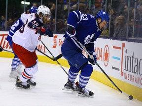 Shawn Matthias of the Toronto Maple Leafs gets away from David Savard of the Columbus Blue Jackets Jackets during NHL action at the Air Canada Centre in Toronto on Jan. 13, 2016. (Dave Abel/Toronto Sun/Postmedia Network)