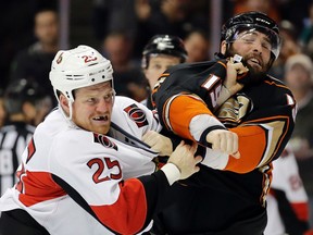 Ottawa Senators right winger Chris Neil, left, brawls with Anaheim Ducks left winger Patrick Maroon during the second period of an NHL hockey game in Anaheim, Calif., on Jan. 13, 2016. (AP Photo/Chris Carlson)